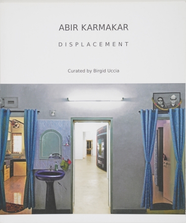 Abir Karmakar, Displacement, catalogue cover, blue walls, room with wash sink